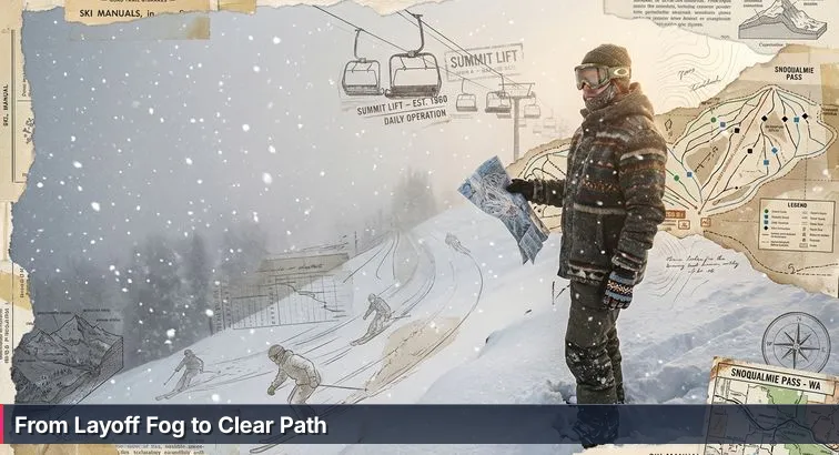 Person sitting on a foggy mountain ridge with a laptop open, overlooking a misty slope and a distant Seattle skyline.
