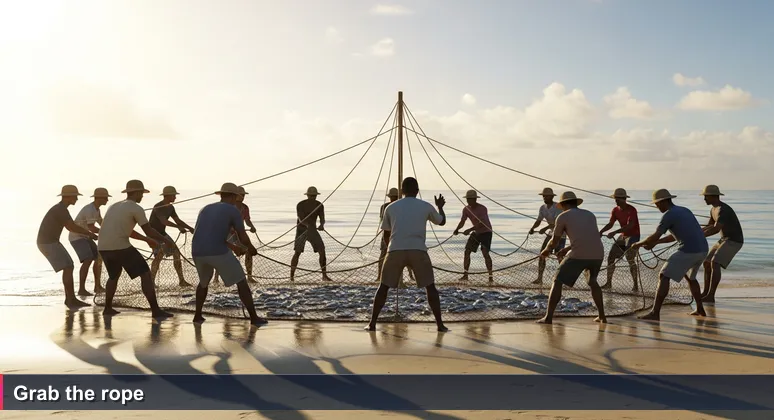 Seychellois fishermen pulling a heavy fish net at dawn on Beau Vallon beach, Mahé, with one man calling the rhythm 'Ale! Ale!'