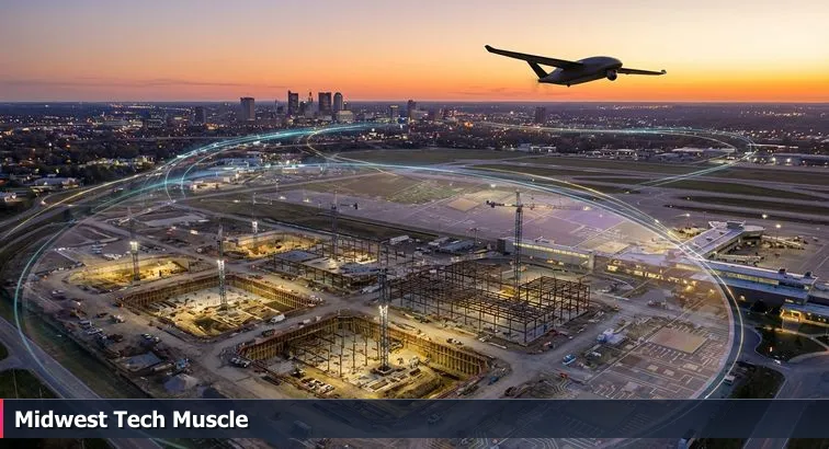 Aerial view of Columbus skyline with a large industrial campus under construction, silhouetted drone overhead, and a semiconductor wafer inset.