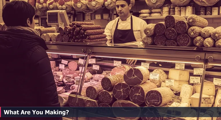 A customer at a Jersey City deli counter, overwhelmed by choices of meats and cheeses, symbolizing the selection process for top AI engineering careers.